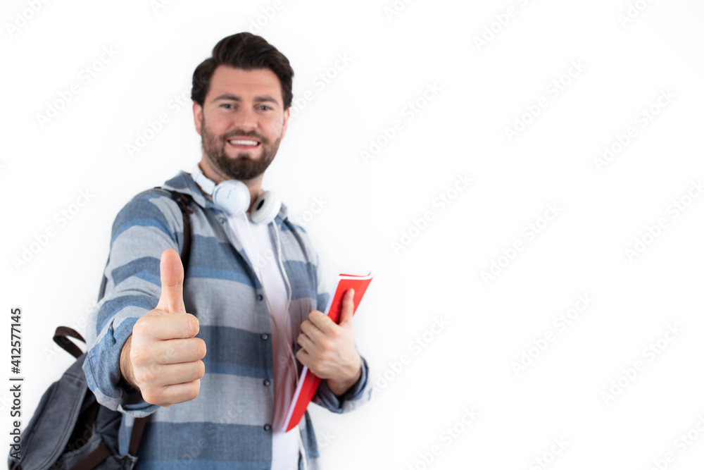 Casual wear content young man posing with backpack and textbook. Student and education concept, isolated on white background. Casual wear content young man posing with backpack and textbook. Student and education concept, isolated on white background.