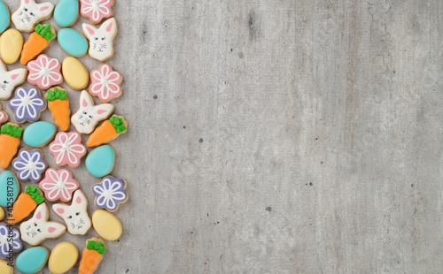 Easter cookies over light gray background with copy space