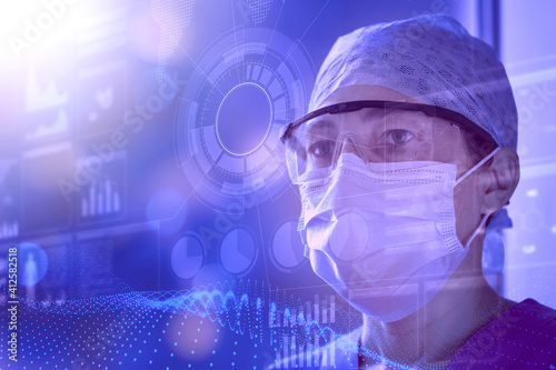 Female scientist wearing lab glasses and protective mask examines data on a transparent digital screen. Concept of innovative technology in medical research, HUD style.