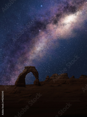 Delicate Arch under the Milky Way in a starry night sky. Arches National Park, Utah..