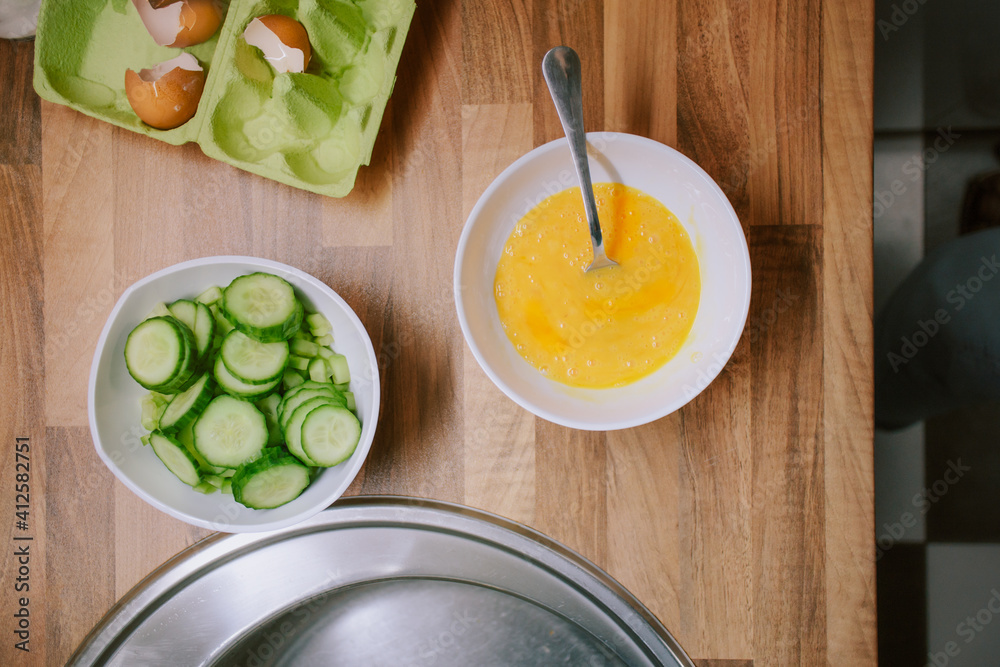 Preparing eggs for breakfast in home kitchen. Preparing eggs for breakfast in home kitchen.
