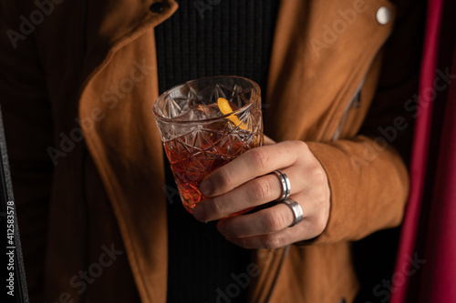 aperitif cocktail with decorations, boy with drink