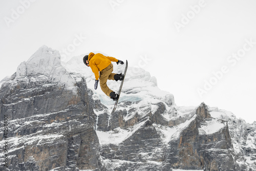 Snowboard ski freestyle big air contest in the background Mittelhorn mountain. Snowboard tricks, ski tricks. Jungfrau region Switzerland