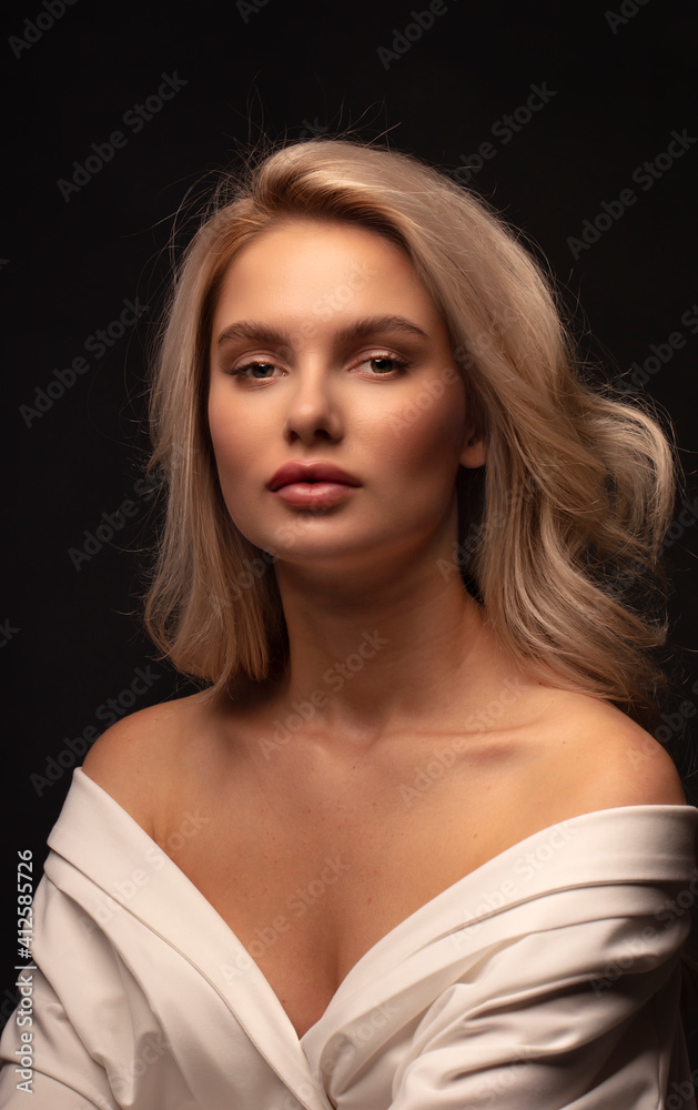 Blonde, studio portrait of a young girl Blonde, studio portrait of a young girl