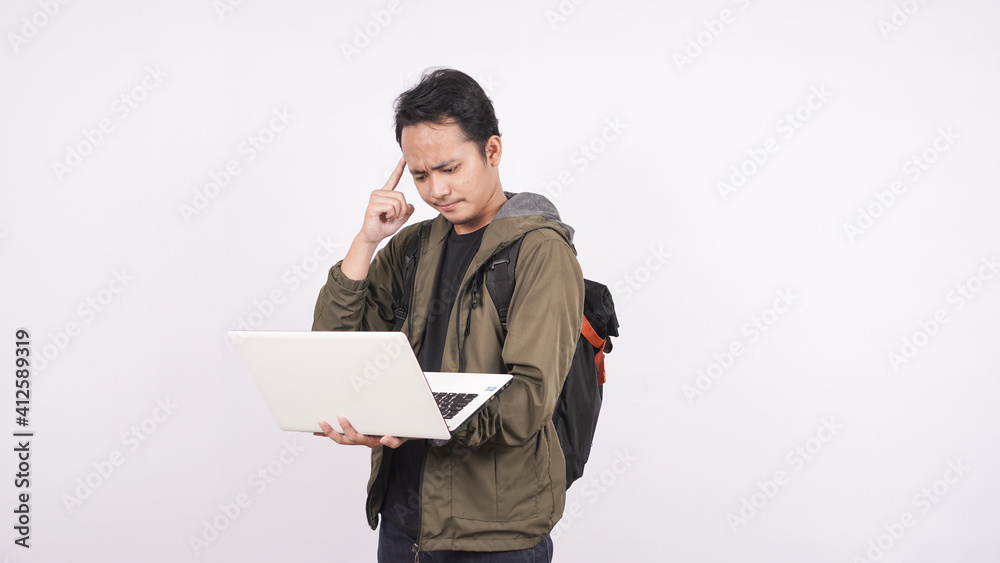 The young man was wearing a bag while thinking The young man was wearing a bag while thinking