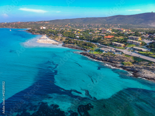 Spectacular landscape aerial view by Drone in Stintino, Spiaggia della Pelosa  - Sardegna in a sunny day with blue sky and and turquoise water,  Summer Season. Italian holiday.