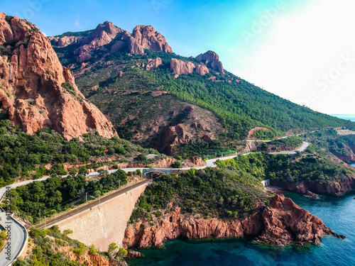 Aerial view by Drone in Saint-Raphaël near Agay on c like to be in USA. Roches Rouges by the mediterranean sea. Toursim in Côte d'Azur, sud France. Blue water and rocks.