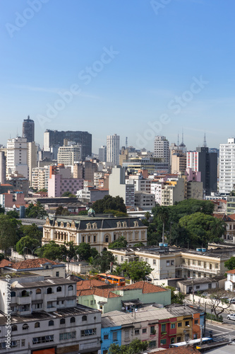 Beautiful view of S  o Paulo city skyline  avenues  houses and downtown business buildings in the background on sunny summer day with blue sky. Concept of urban  travel  latin america  tourism.