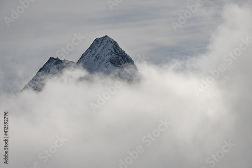 View of the Swiss mountains in winter. Eiger in clouds, Monoch and Jungfrau. Swiss alps in Switzerland Jungfrauregion. © Chawran