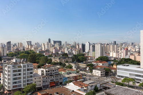 Beautiful view of São Paulo city skyline, avenues, houses and downtown business buildings in the background on sunny summer day with blue sky. Concept of urban, travel, latin america, tourism.