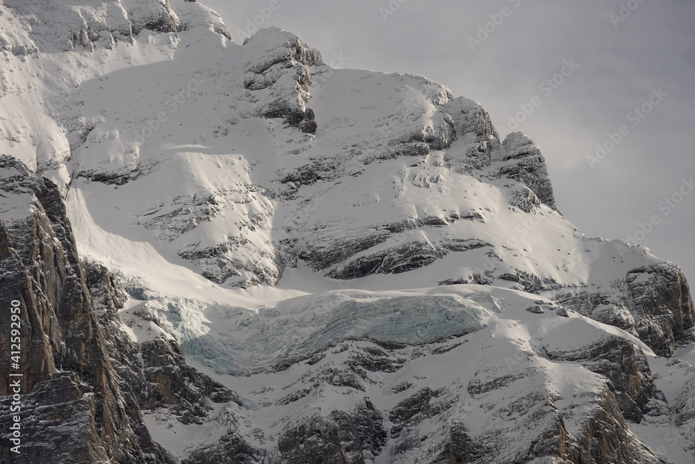 Obraz premium View of the Swiss mountains in winter. Mittelhornin clouds, Schreckhorn and Wetterhorn. Swiss alps in Switzerland Jungfrauregion