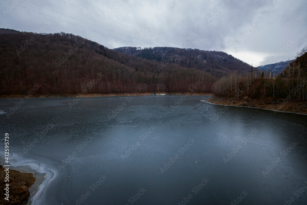 landscape with a lake in the mountains in winter landscape with a lake in the mountains in winter