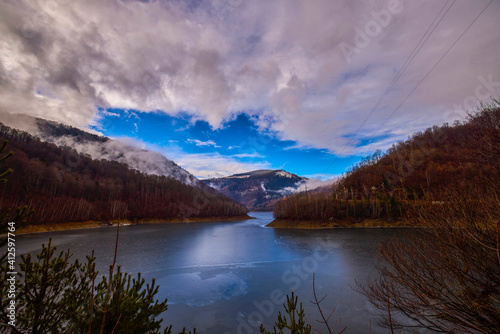 landscape with a lake in the mountains in winter © czamfir