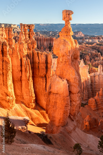 Red sandstone hoodoos and other rock formations under a blue sky in Bryce Canyon National Park, Utah