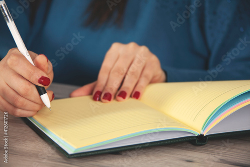 woman hand pen with notepad