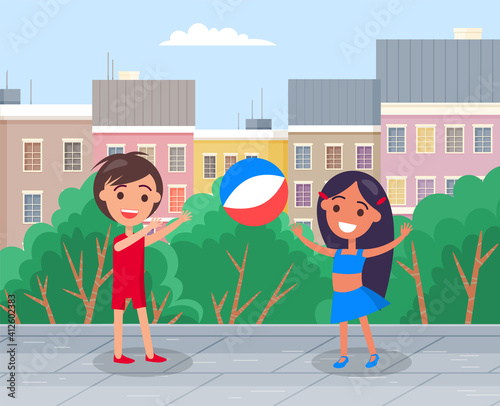 Happy boy and girl smiling friends playing toy ball in the city park. The best summer child s outdoor activities. Active family weekend children s games. Kids volleyball outdoor, team ball game