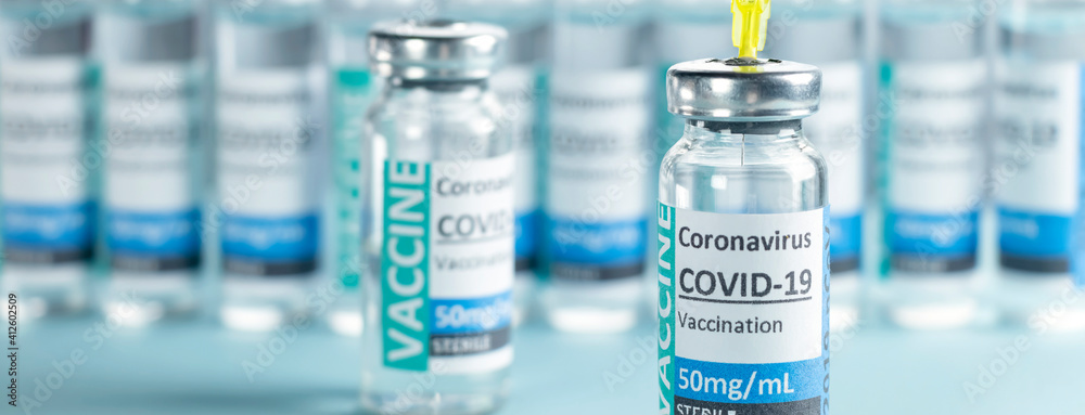 Banner Covid-19 Corona Virus 2019-ncov vaccine vials medicine drug bottles syringe injection blue nitrile surgical gloves. Vaccination, immunization, treatment to cure Covid 19 Corona Virus infection Banner Covid-19 Corona Virus 2019-ncov vaccine vials medicine drug bottles syringe injection blue nitrile surgical gloves. Vaccination, immunization, treatment to cure Covid 19 Corona Virus infection