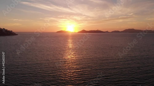 Beautiful view of the beach, aerial view of the beach, acapulco beach seen from above. Travel and vacation concept. Colorful sunset on the beach. Aerial video