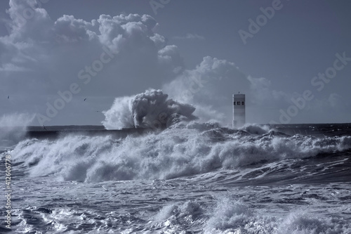 Storm at the Douro mouth north beacon and pier