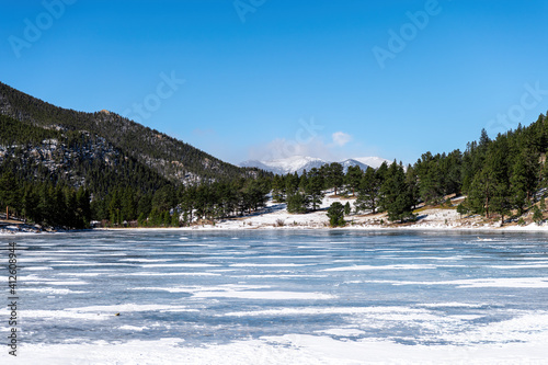 Frozen Lily Lake at winter, january with cold weather and snow. Rocky Mountains, Estes Park, Colorado, USA