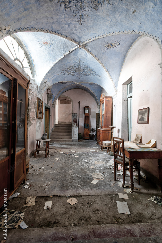 November 2020, Italy. Entrance frescoed and furnished with paintings and statues depicting lions from an abandoned house in Northern Italy. Urbex in Italy