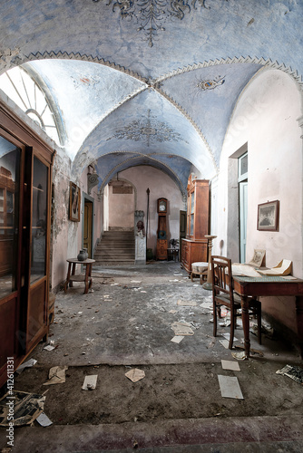 November 2020, Italy. Entrance frescoed and furnished with paintings and statues depicting lions from an abandoned house in Northern Italy. Urbex in Italy