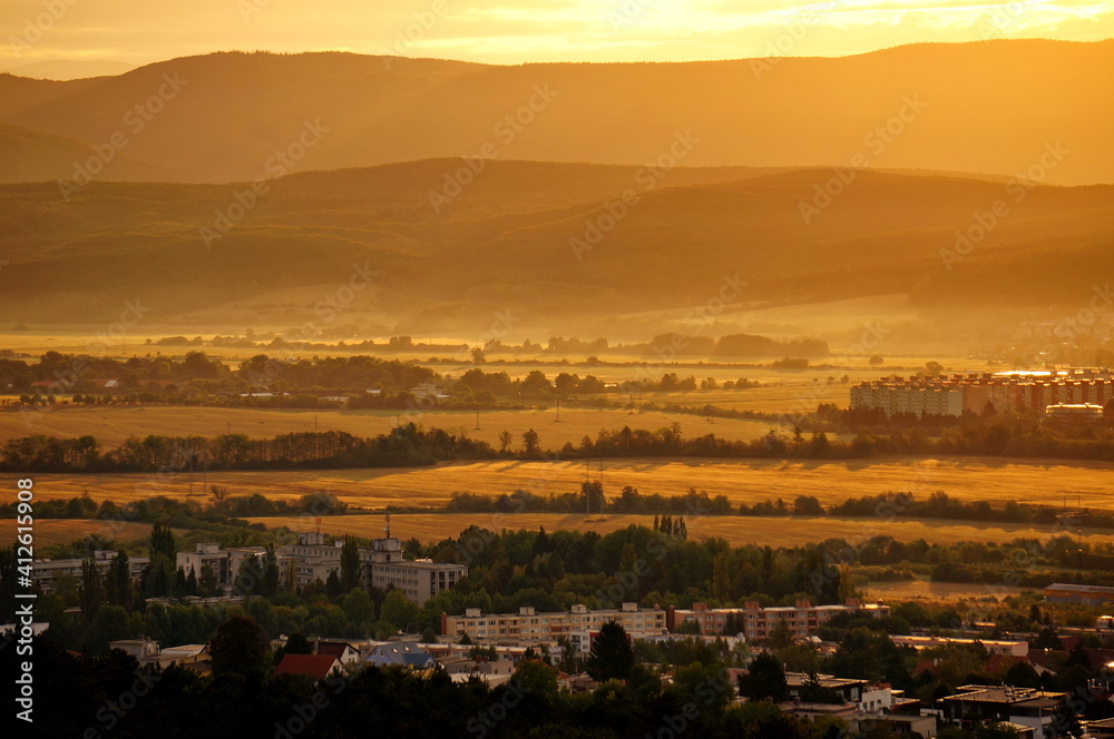 Beautiful aerial landscape view in Slovakia in a warm yellow light at sunrise