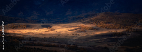 dawn ray of light in the Kurai steppe, Chui ridge, Altai Mountain in autumn, Russia