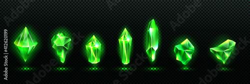 Precious emerald stones, shiny green crystals isolated on transparent background. Vector realistic set of glow gemstones different shapes, crystal gems with magic light photo