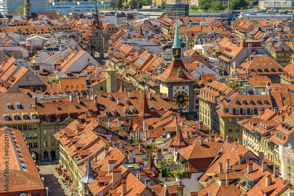 Aerial view of Bern old town, Switzerland, UNESCO World Heritage Site since 1983 from Cathedral bell tower. Details of Zytglogge or Clock Tower and the narrow medieval alleys.
