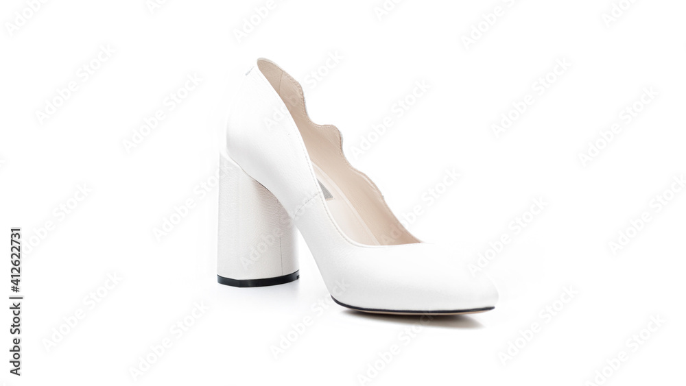 women's white shoe with a heel on a solid background women's white shoe with a heel on a solid background