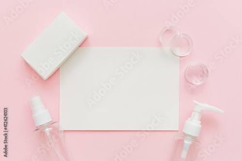Skin care template, Beauty concept. Skin care products, bottles, spray and soap on pink background. Free space for text, copy space.
