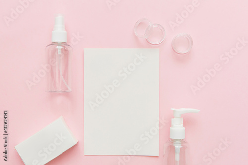Skin care mockup. Beauty concept. Skin care products, bottles, spray and soap on pink background. Free space for text, copy space.
