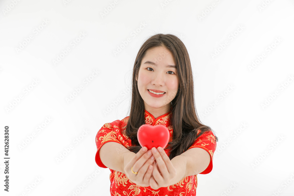 Asian young pretty woman wearing red Chinese Traditional dress for New year celebration and Valentine Asian young pretty woman wearing red Chinese Traditional dress for New year celebration and Valentine