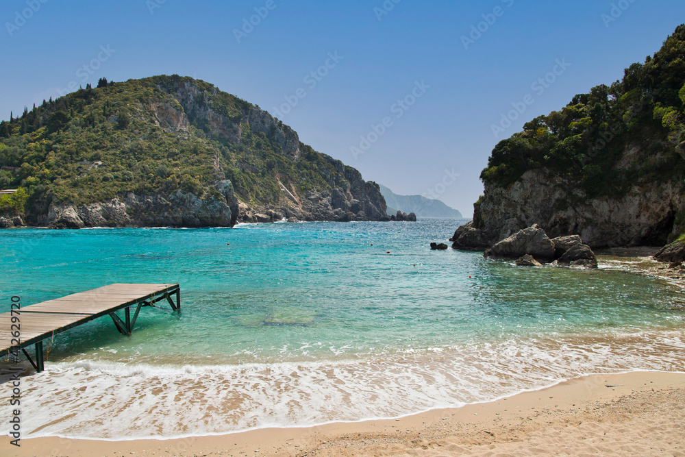The beautiful pristine beach at Corfu island , Greece