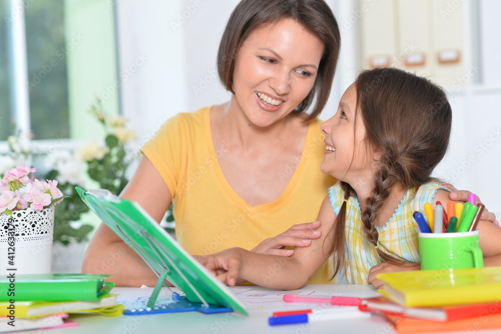 Mother and her daughter doing homework Mother and her daughter doing homework