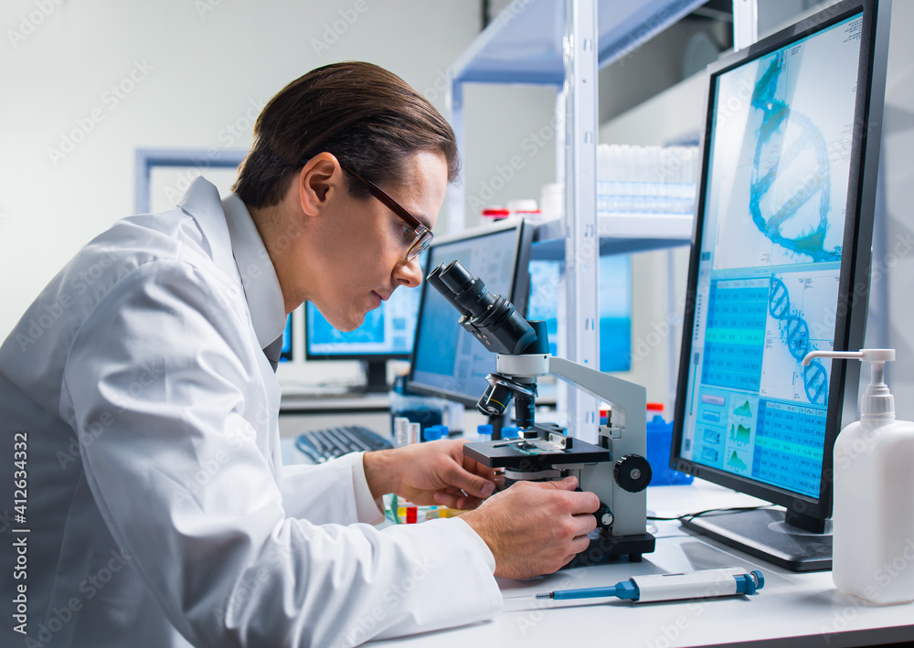 Professional scientist is working on a vaccine in a modern scientific research laboratory. Genetic engineer workplace. Future technology and science. Professional scientist is working on a vaccine in a modern scientific research laboratory. Genetic engineer workplace. Future technology and science.