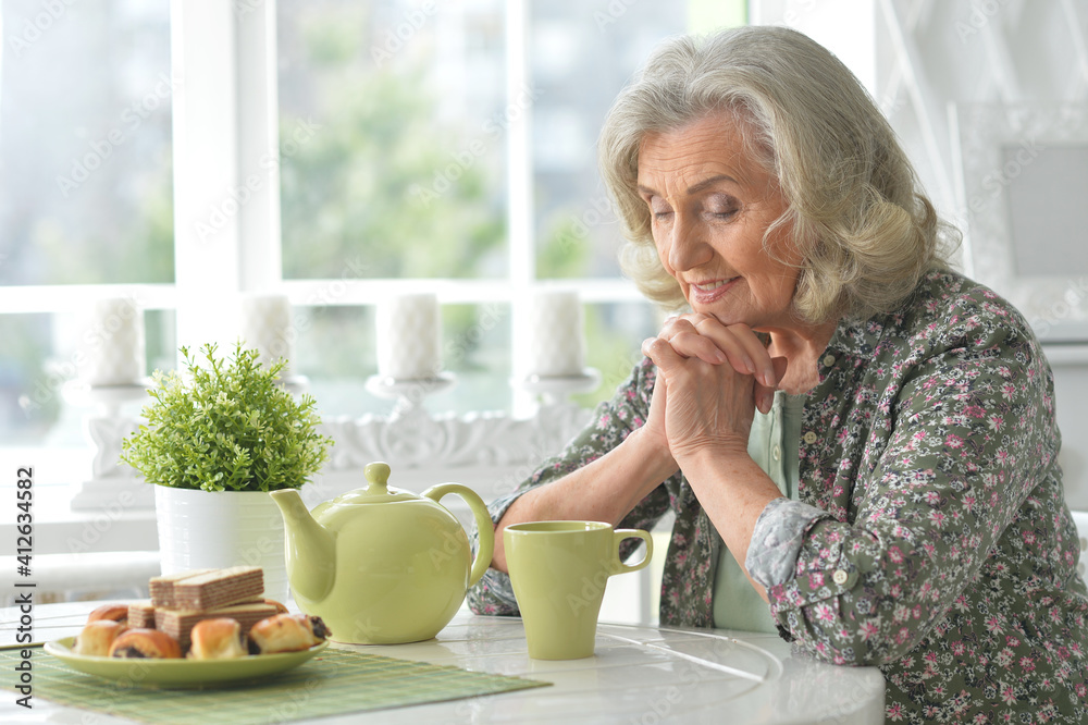 Beautiful smiling senior woman drinking tea Beautiful smiling senior woman drinking tea