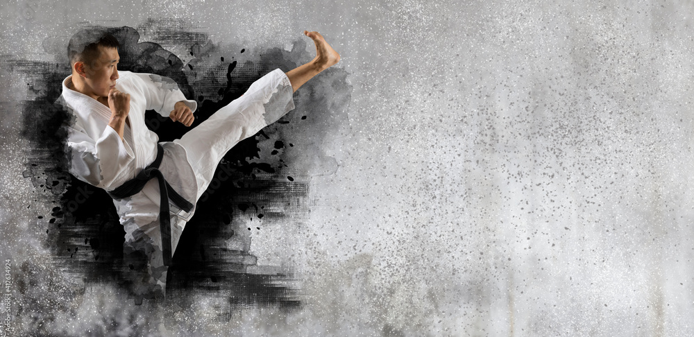 Obraz Martial arts master on wall background