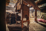 old factory fragment of the interior of a room with wooden structures and equipment