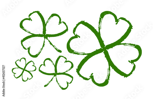 Set of Hand drawn brush shamrocks on white background. Sketch line clover.