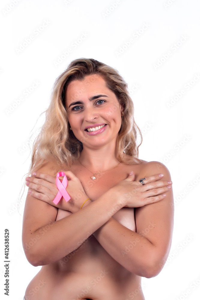 woman covering breasts with hands with pink ribbon woman covering breasts with hands with pink ribbon