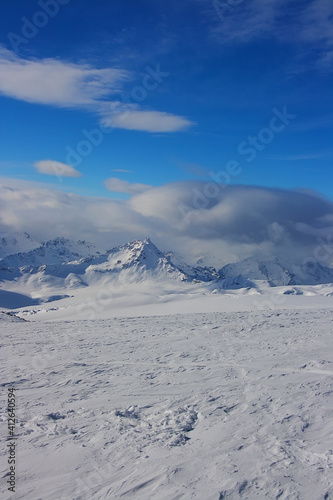 Winter landscape of the mountains of the North Caucasus in the snow with clouds. © Octopusart