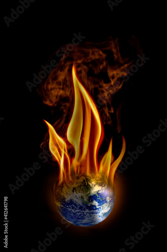 Earth in flames in a black background