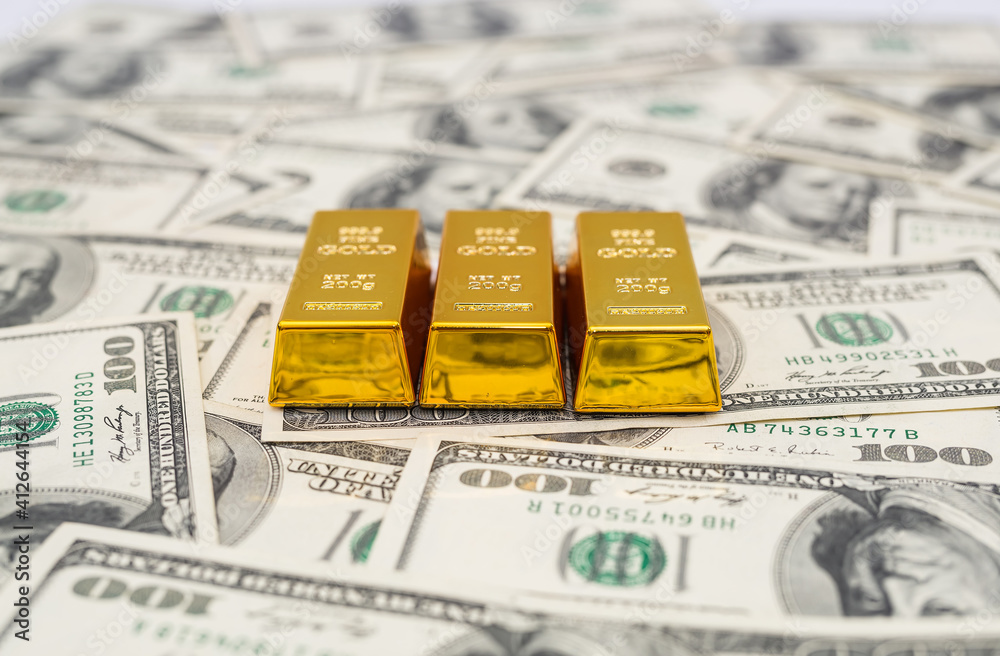 gold bars on 100 new US dollar banknotes. gold bars on 100 new US dollar banknotes.