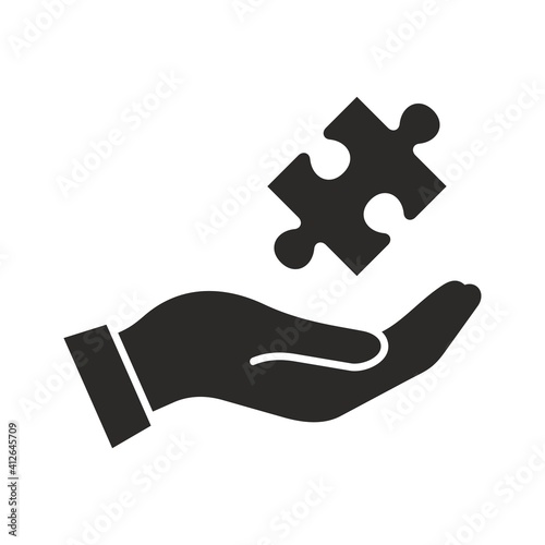 Puzzle icon. Puzzle piece in hand. Vector icon isolated on white background.