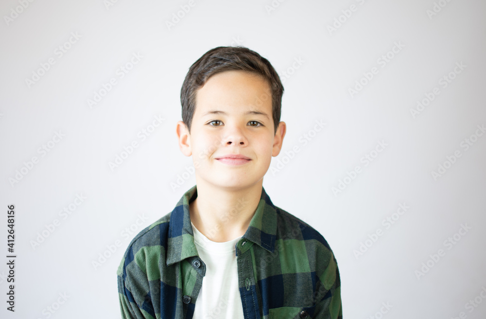 Portrait of happy young boy confident boy standing isolated on blue Portrait of happy young boy confident boy standing isolated on blue