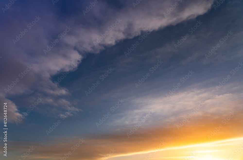 Beautiful bright sunset sky with colorful clouds. Nature sky background. Dramatic sunset.