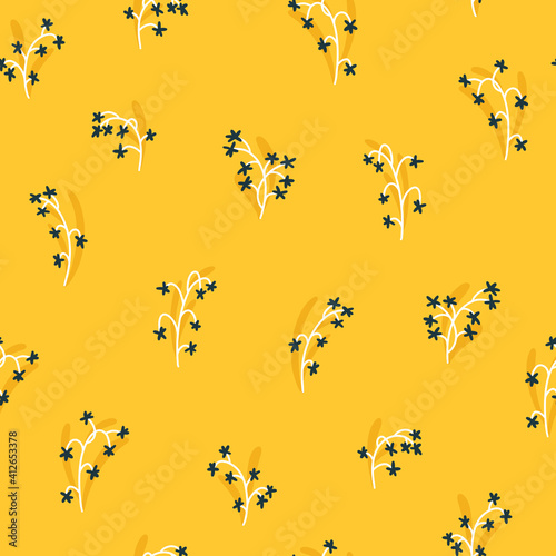 Floral seamless vector pattern with small flowers. Simple hand-drawn style. Motifs scattered liberty. Pretty ditsy background for fabric, textile, wallpaper. Digital paper in yellow color