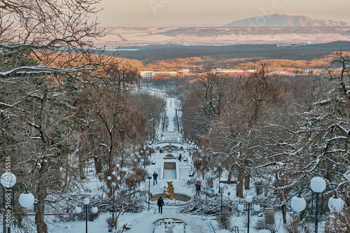 Snow-covered Cascade staircase of Zheleznogorsk Park is a tourist attraction of the resort town, Russia. photo